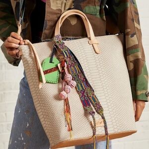 NWT Consuela Thunderbird Sling Women’s HandBag - Cream w/ Multicolor Bag Charms